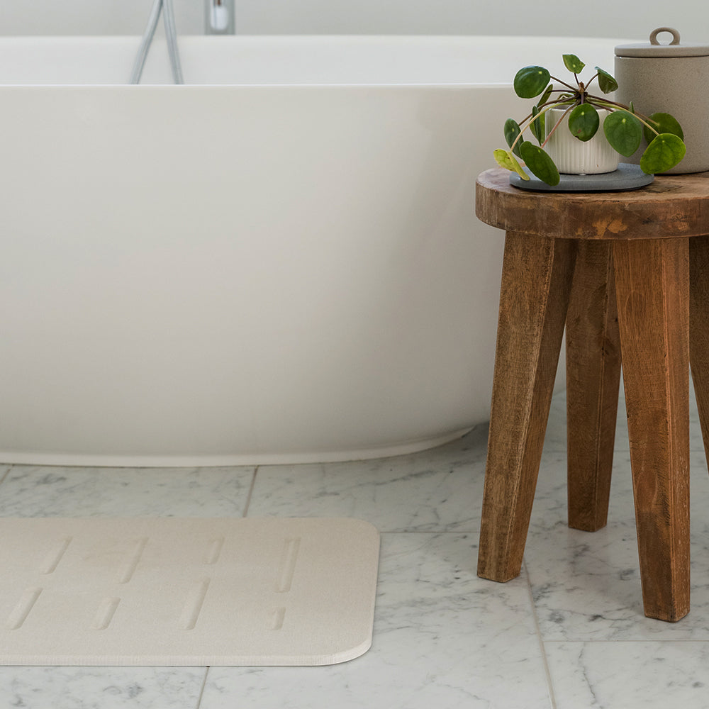 bathroom floor with bath stone from Dorai Home