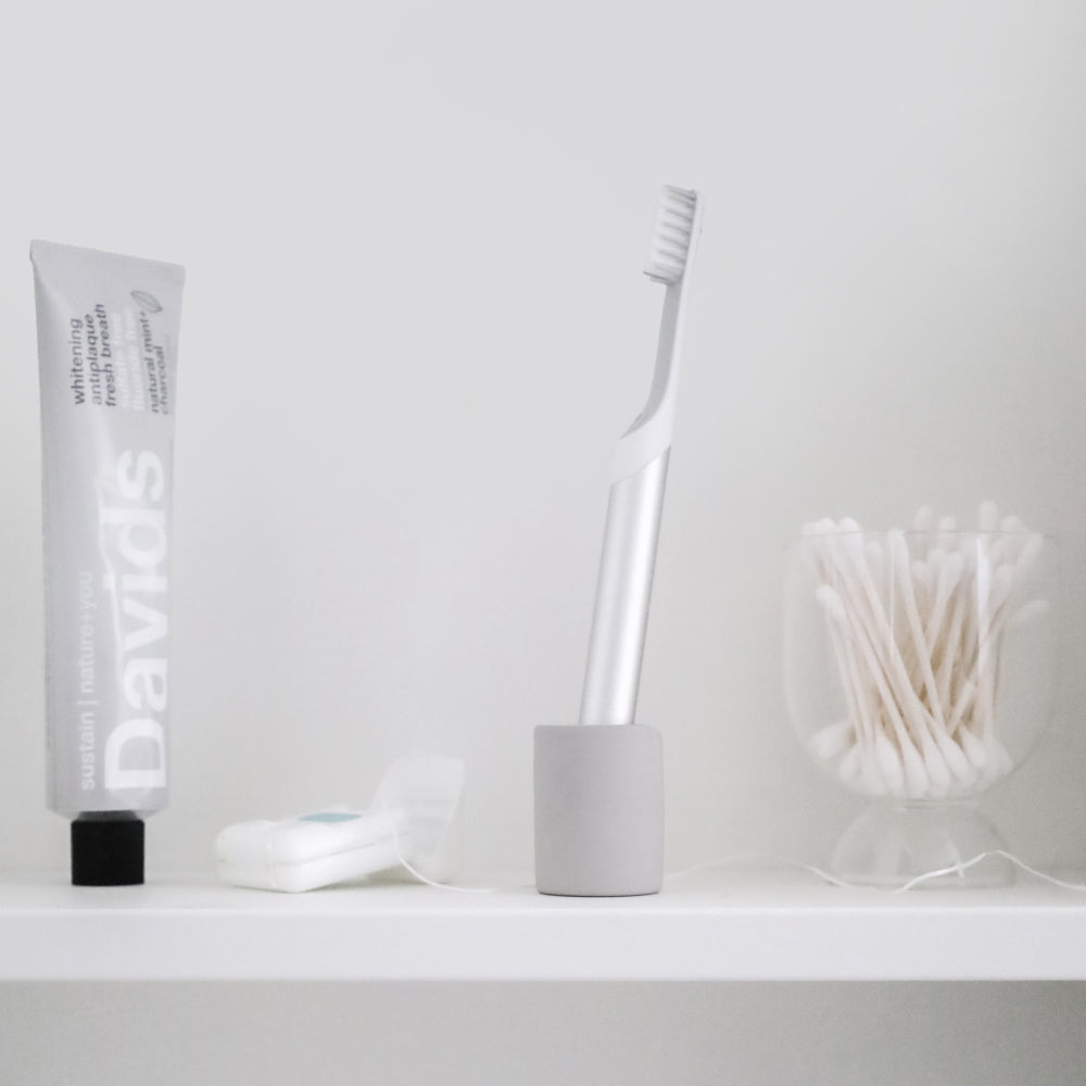 toothbrush in small toothbrush holder made from diatomaceous earth - Dorai Home
