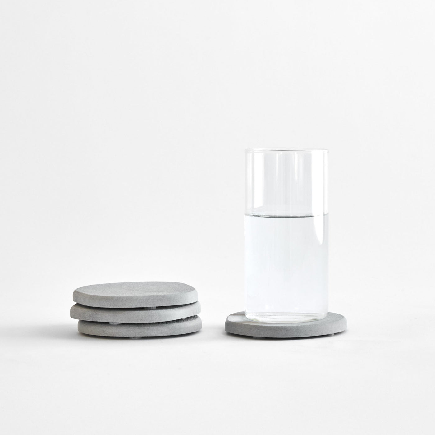 Ash Stone Coaster set stacked with drink.