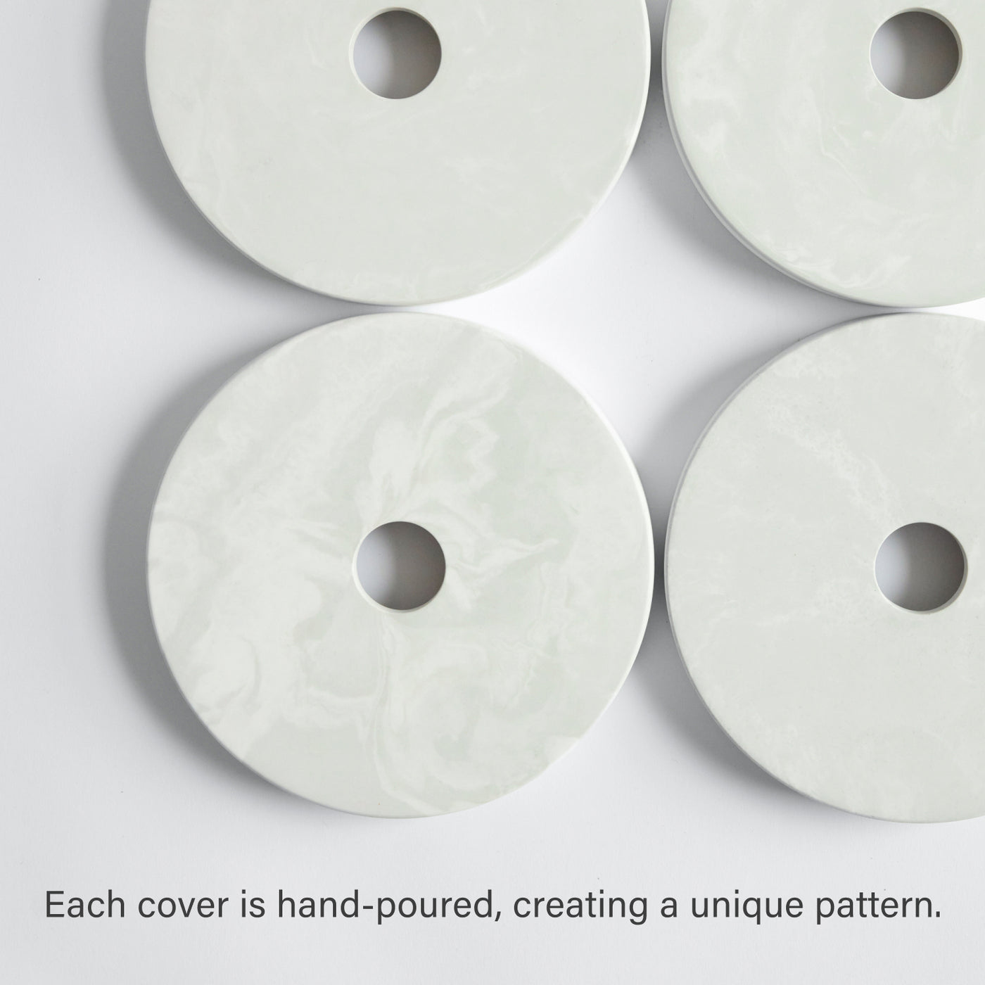 Four paper towel holder bases - each hand, poured creating a custom pattern.