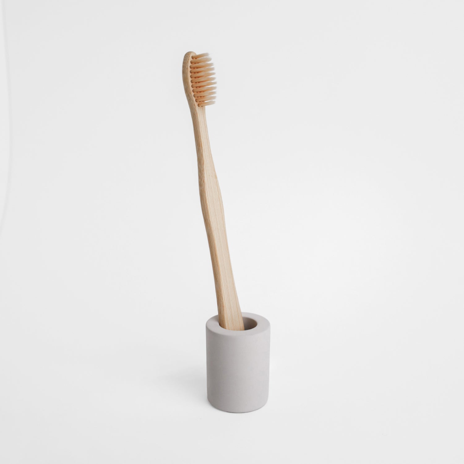 small toothbrush holderm with toothbrush in it, made from diatomaceous earth - Dorai Home