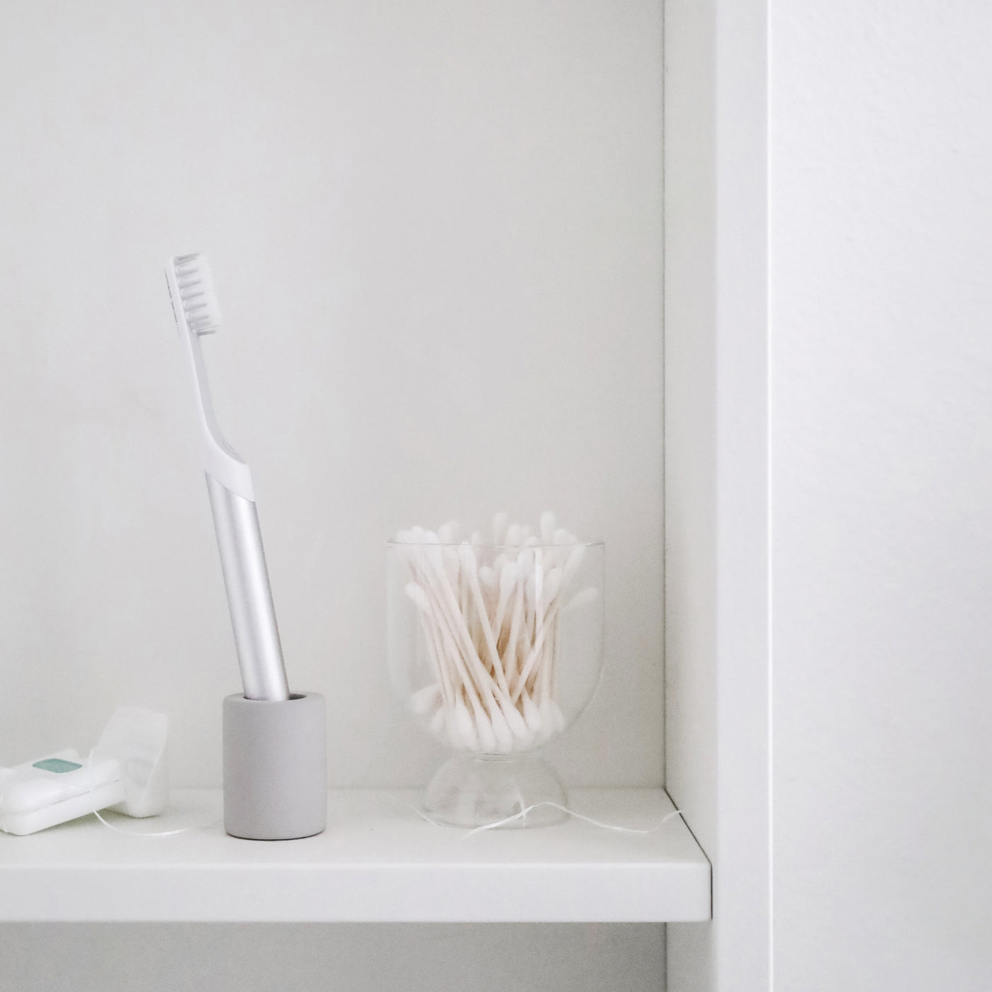 small toothbrush holder, made with diatomaceous earth, with toothbrush in it - Dorai Home