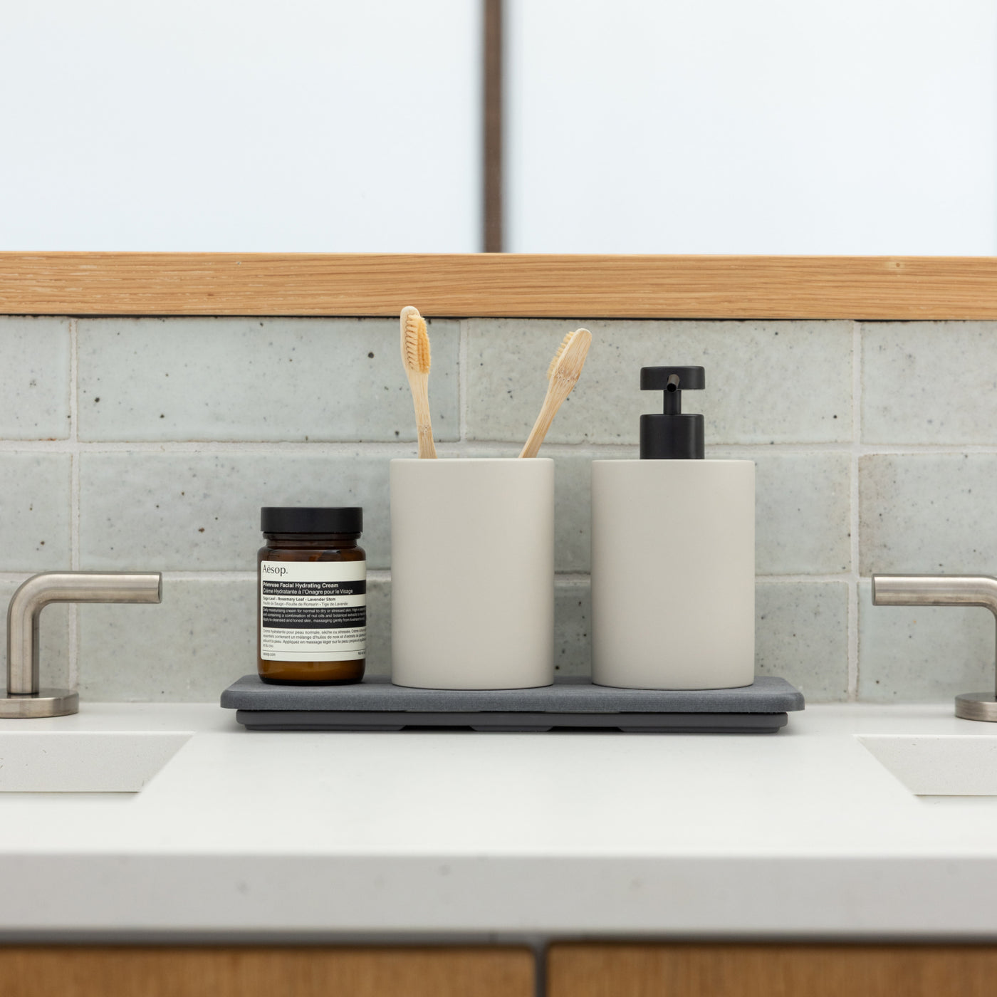 diatomaceous earth stone sink caddy with soap dispenser and brush holder in bathroom - Dorai Home