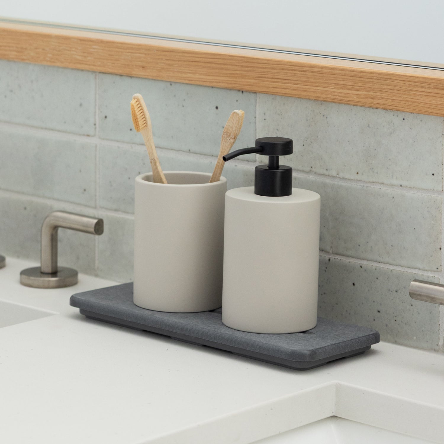 diatomaceous earth stone sink caddy with soap dispenser and brush holder in bathroom - Dorai Home