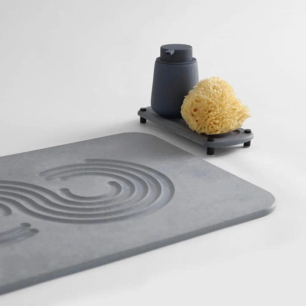 detail of bath stone with sink caddy