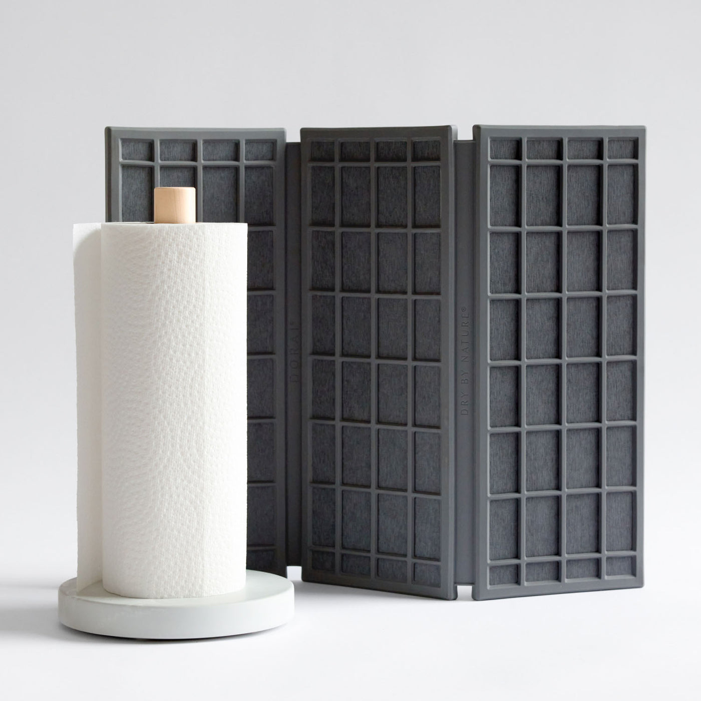 dark grey quick-drying mat with white paper towel holder