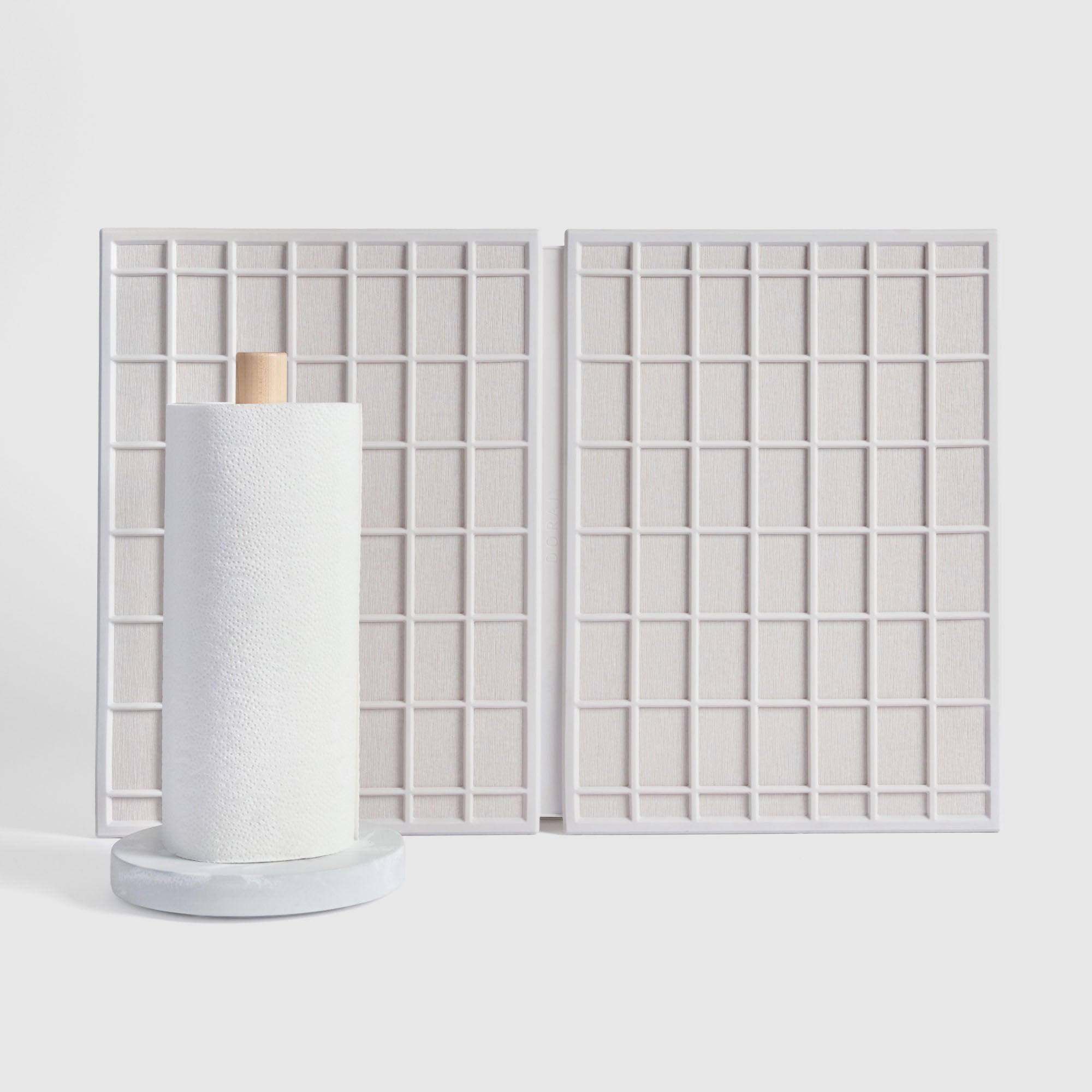 Large Ridge Dish Pad in Glacier and Glacier Paper Towel Holder on white background.