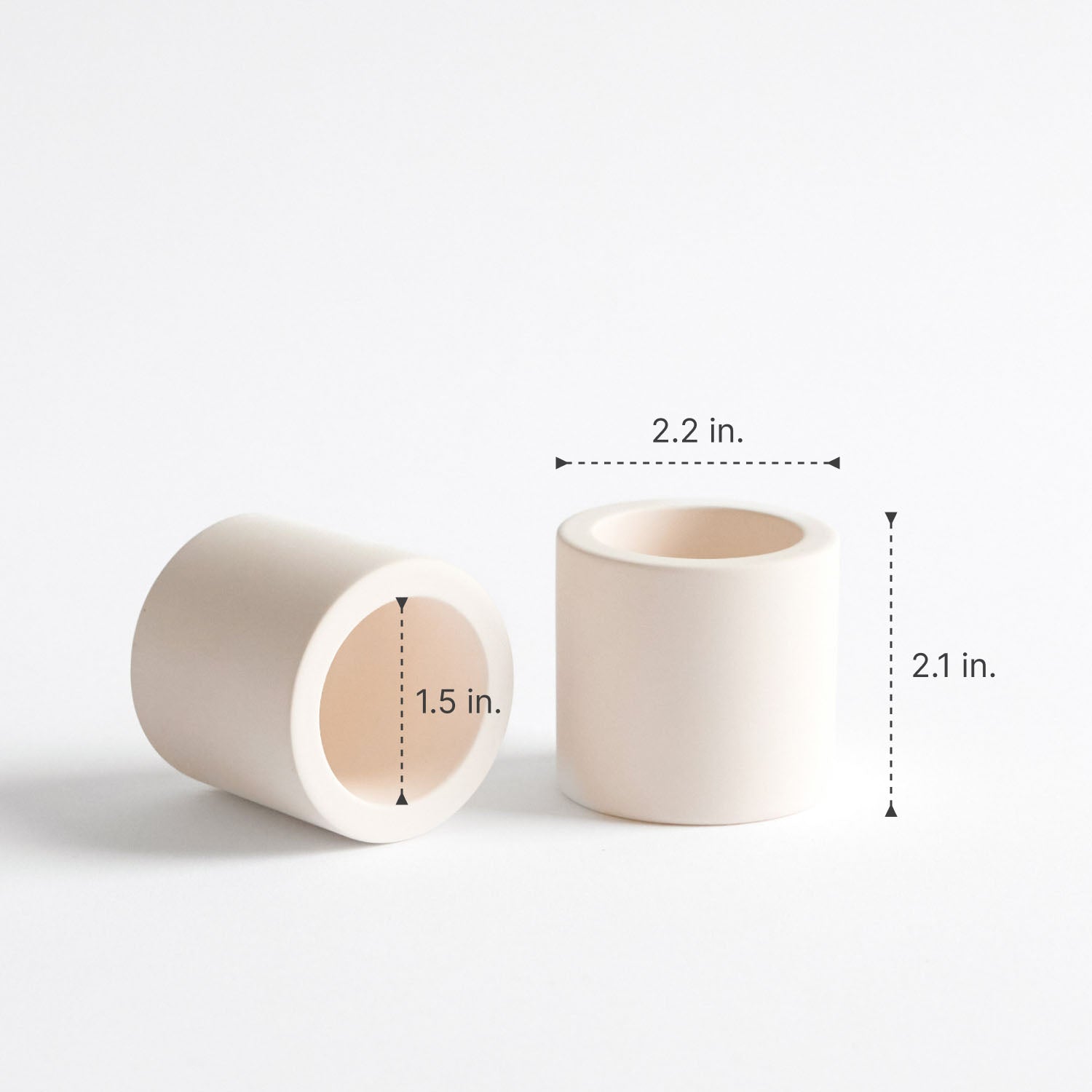 Two stone toothbrush holders with measurements on a white background