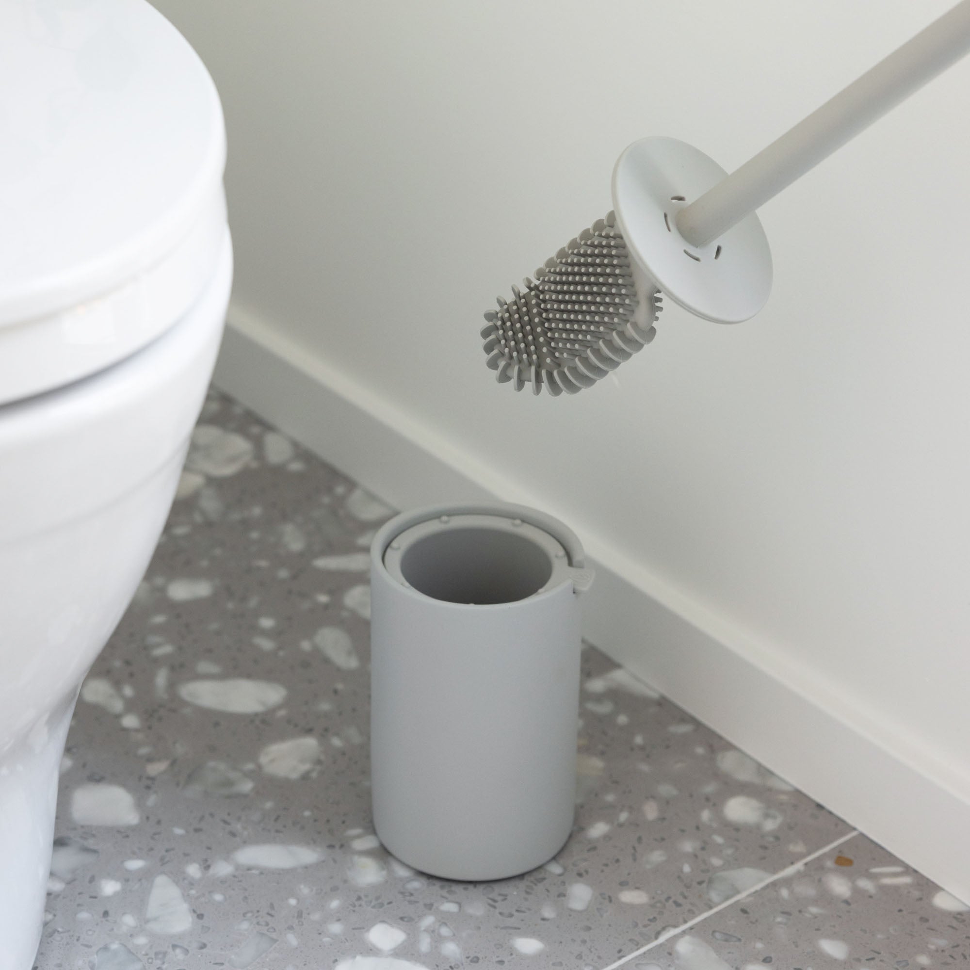 Silicone toilet cleaner in modern toilet brush holder. 