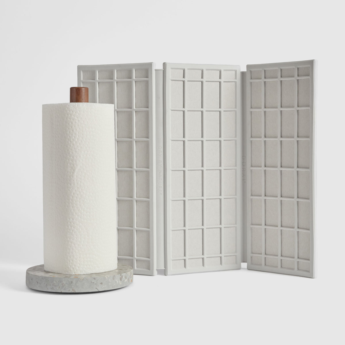 Basalt Paper Towel Holder and Glacier Ridge Dish Pad on white background.