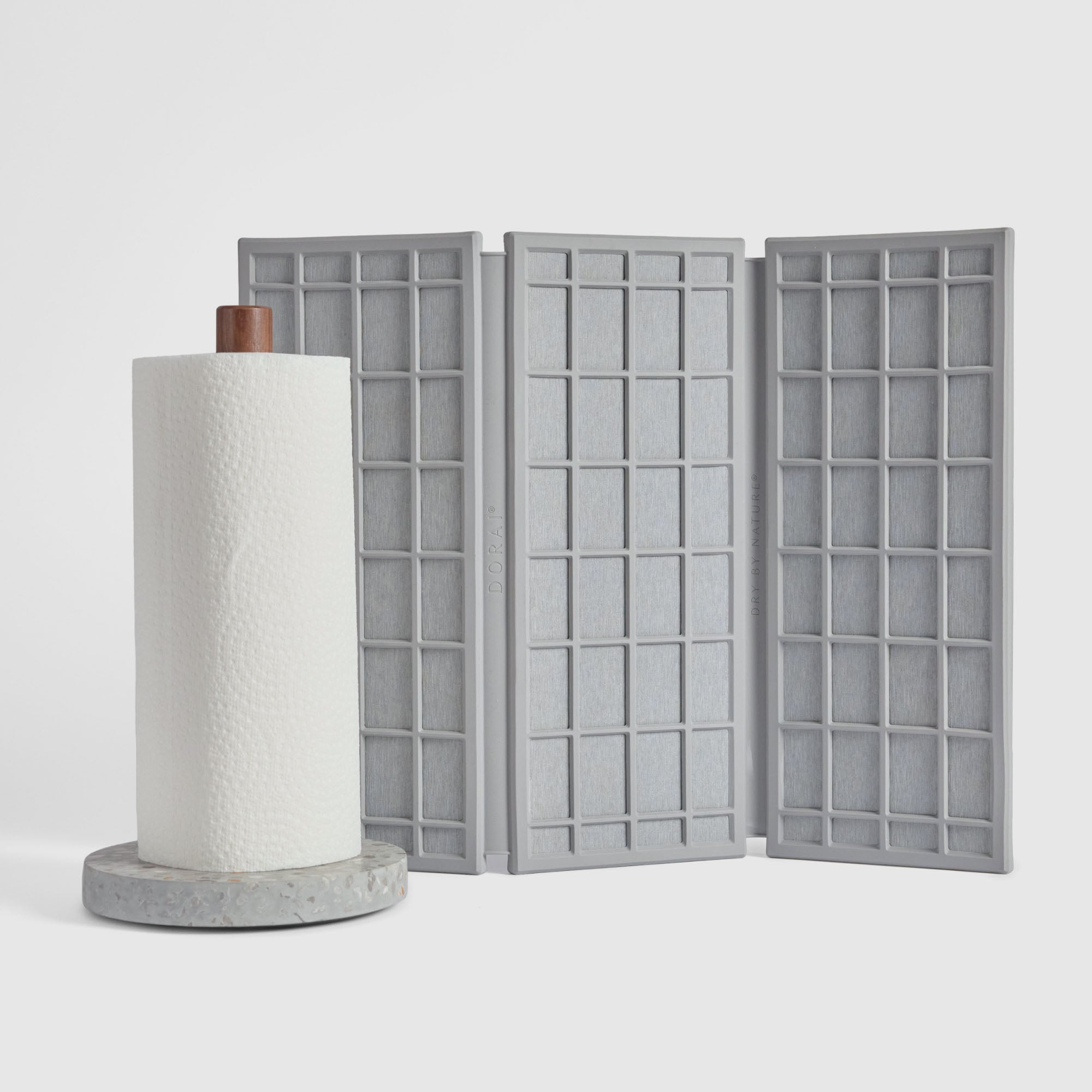 Basalt Paper Towel Holder and Ash Ridge Dish Pad on white background.