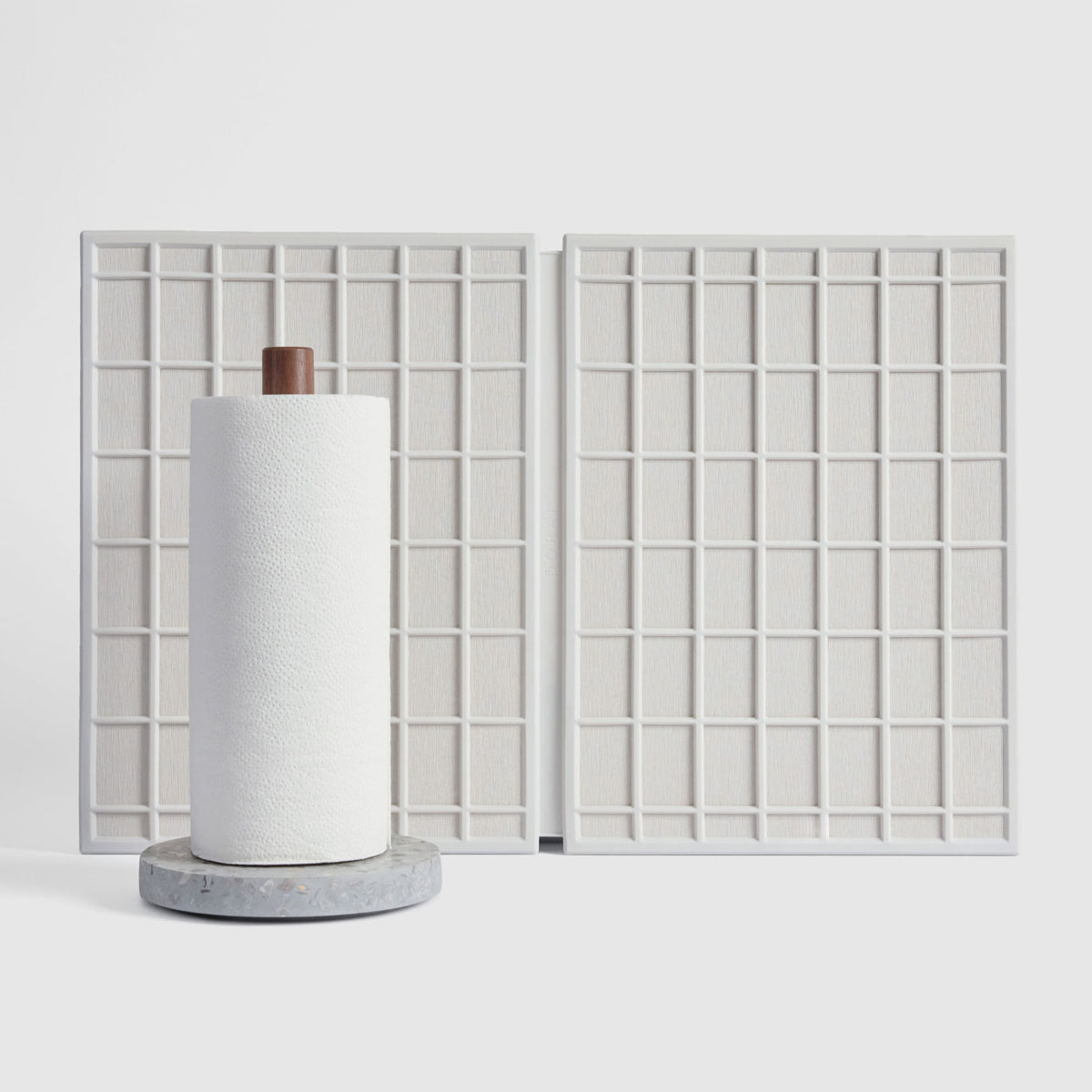Basalt Paper Towel Holder and Glacier Large Ridge Dish Pad on white background.