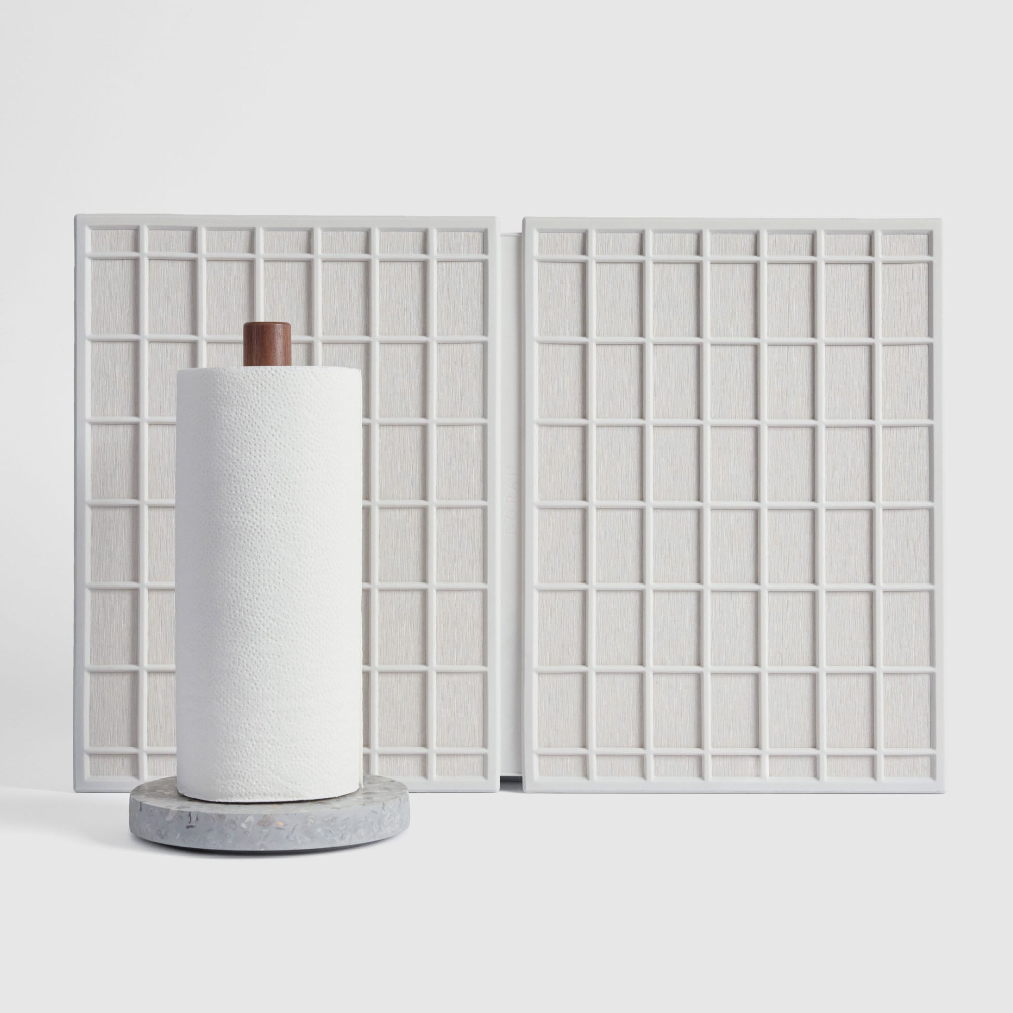Basalt Paper Towel Holder and Glacier Large Ridge Dish Pad on white background.