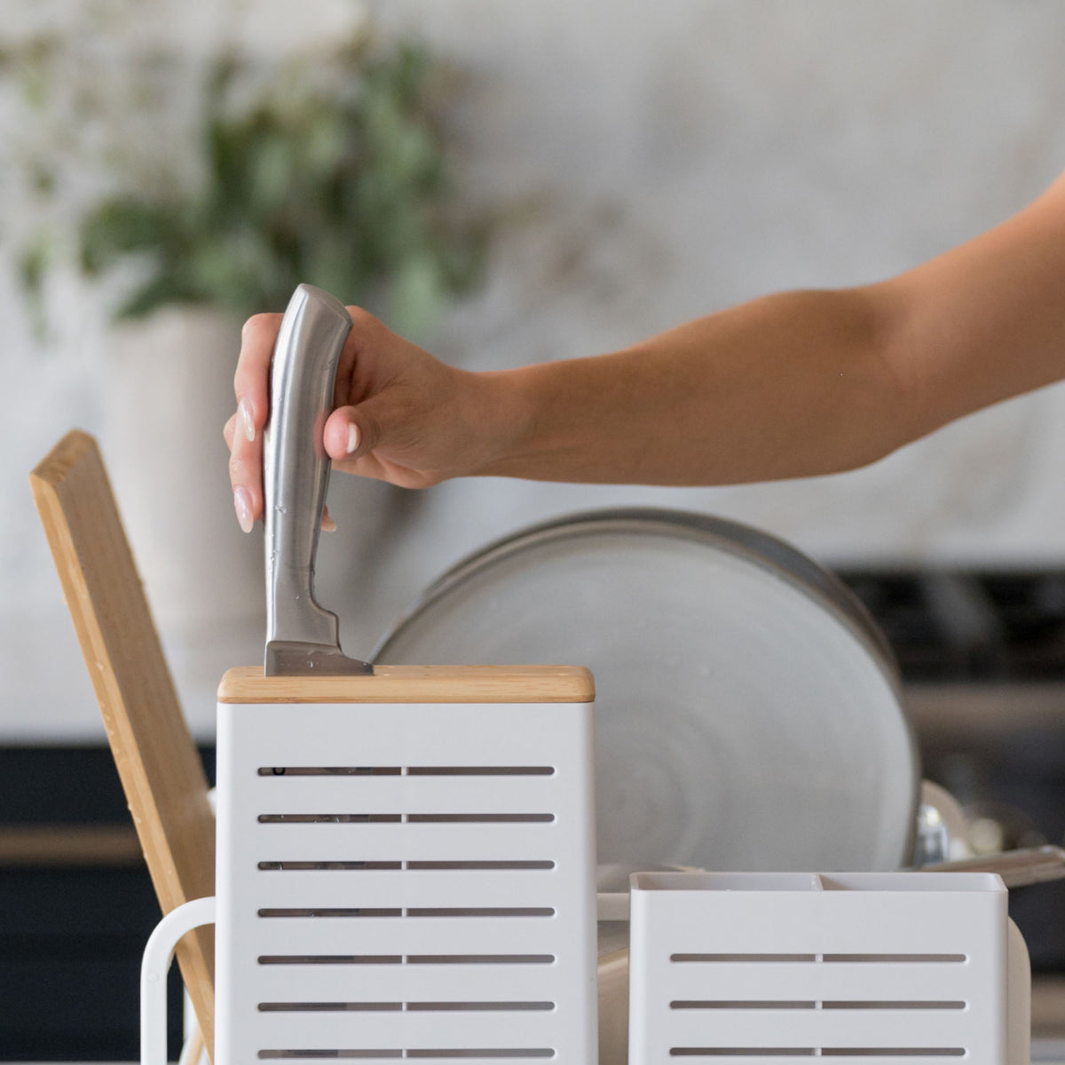 Placing knife in knife-holder on Glacier Dish Rack. 
