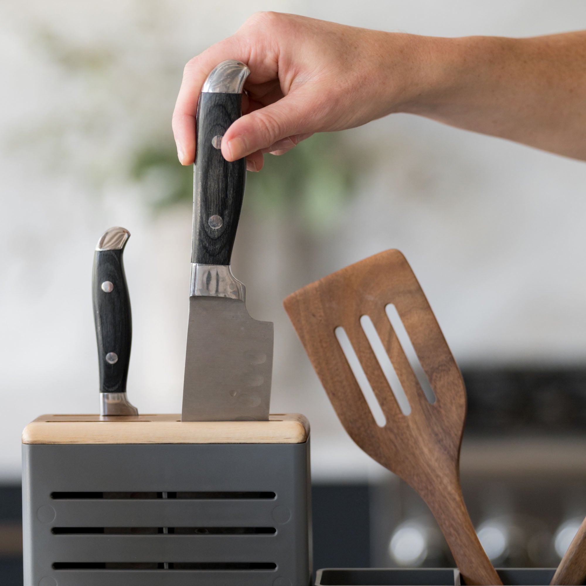 Placing knife in knife-holder on Slate Dish Rack. 
