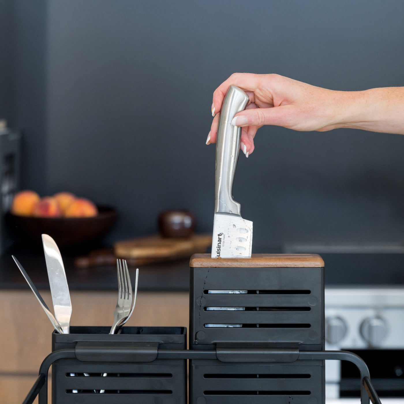 Placing knife in knife-holder on Basalt Dish Rack. 
