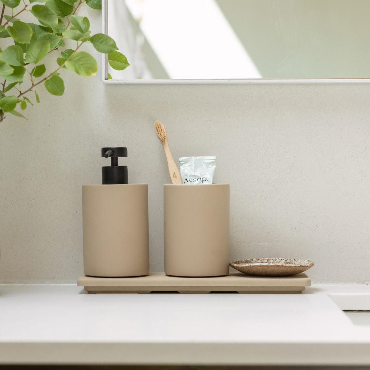 Modern Stone Sink Set in Taupe and Clay in elegant bathroom. 