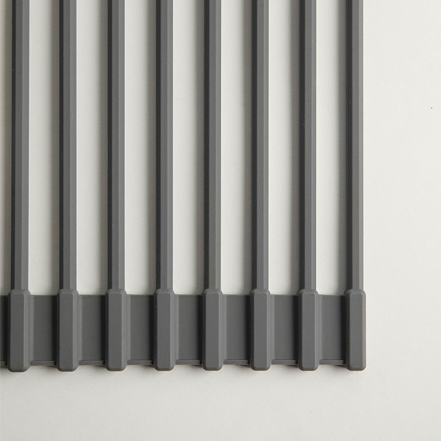 detail of dark grey silicone encased metal rods on roll out dish pad