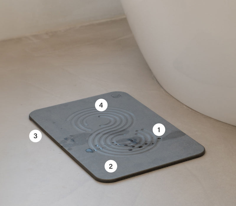 Original bath stone in Slate in front of free-standing tub numbered 1-4