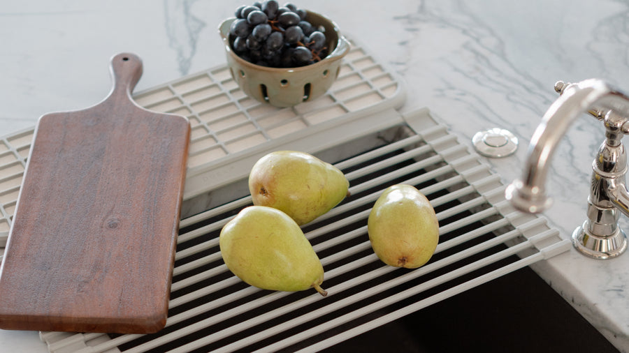 roll up dish drainer with fruit and cutting board