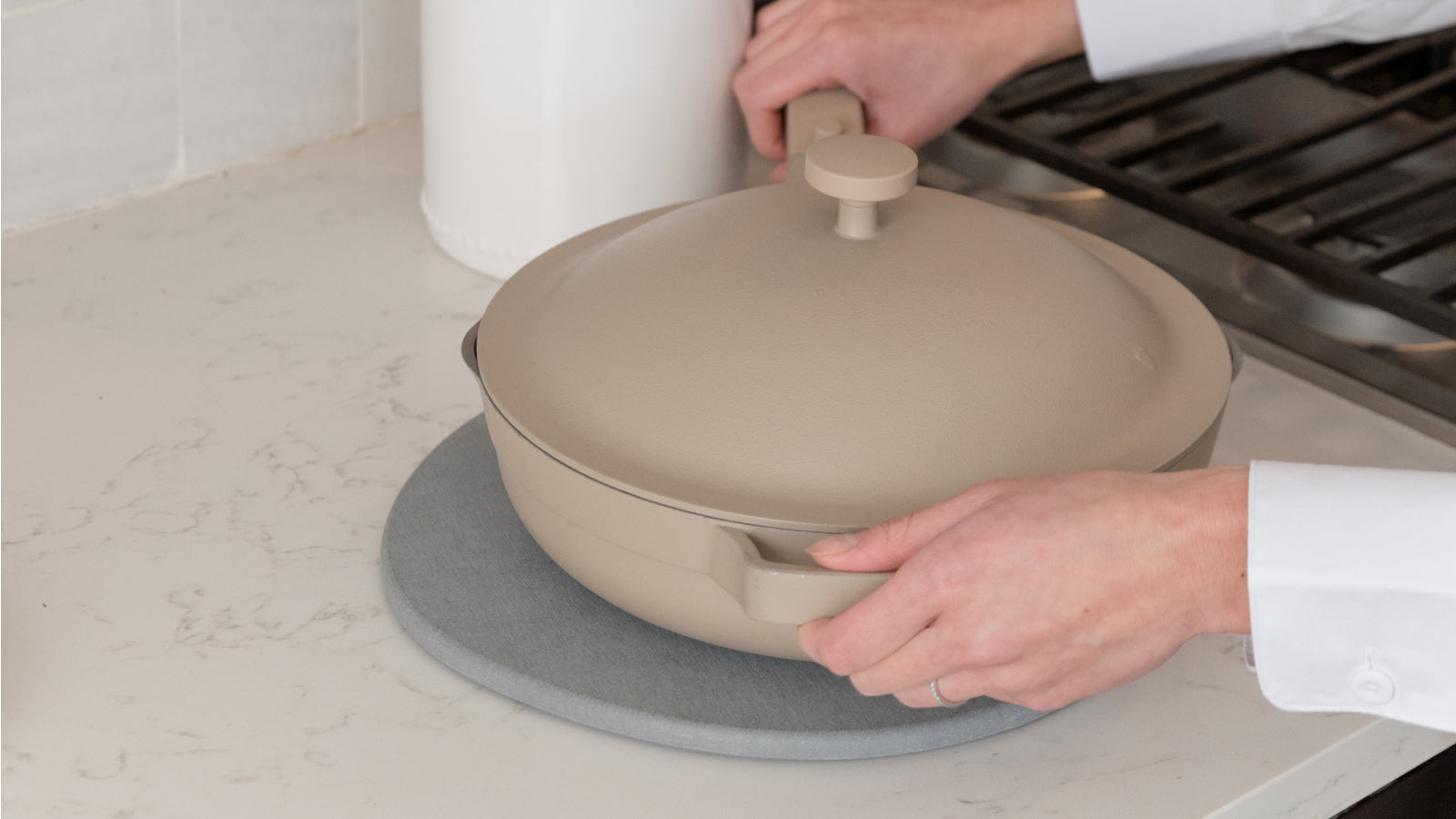 hot pan being put down on trivet