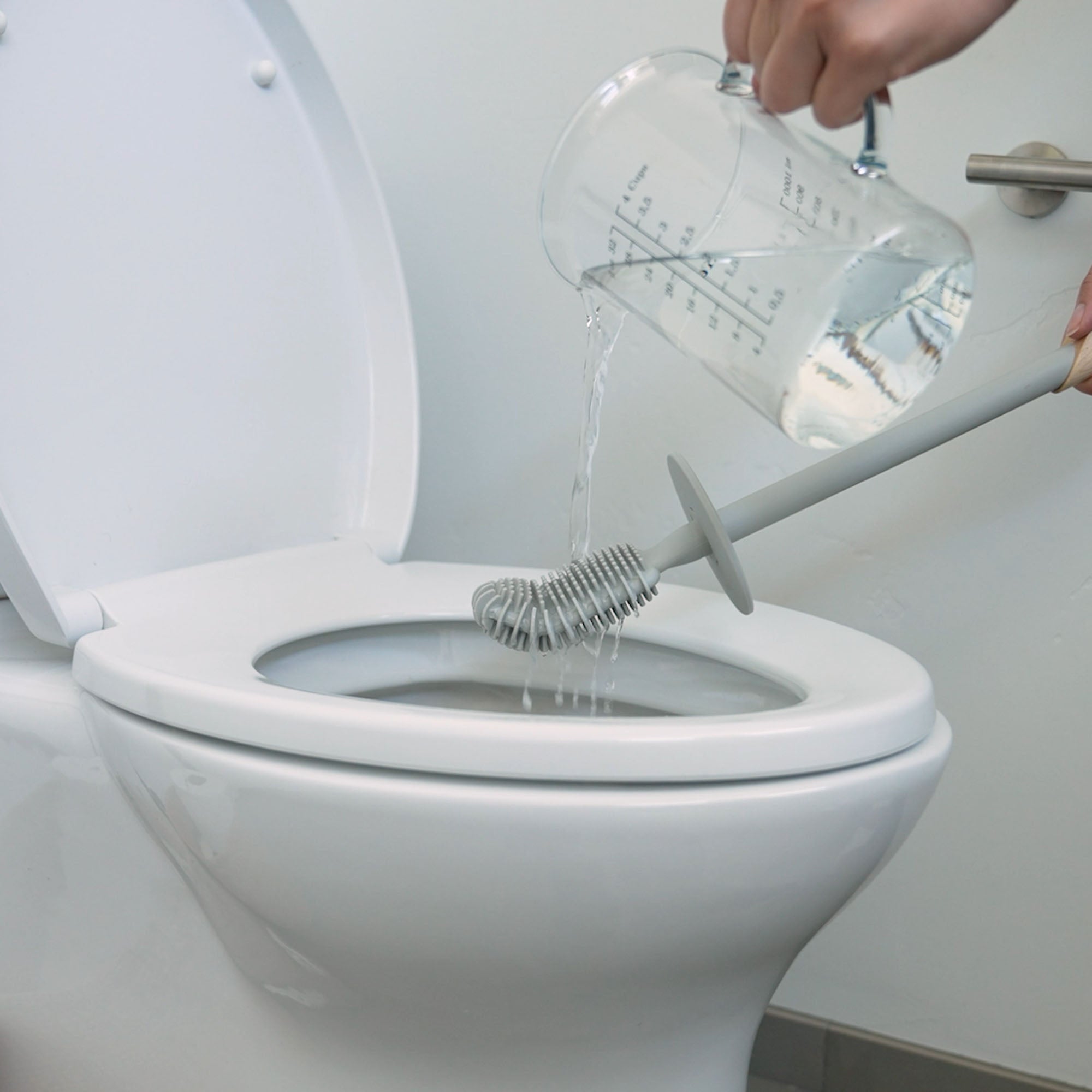 Rinse any soap off over the toilet bowl.