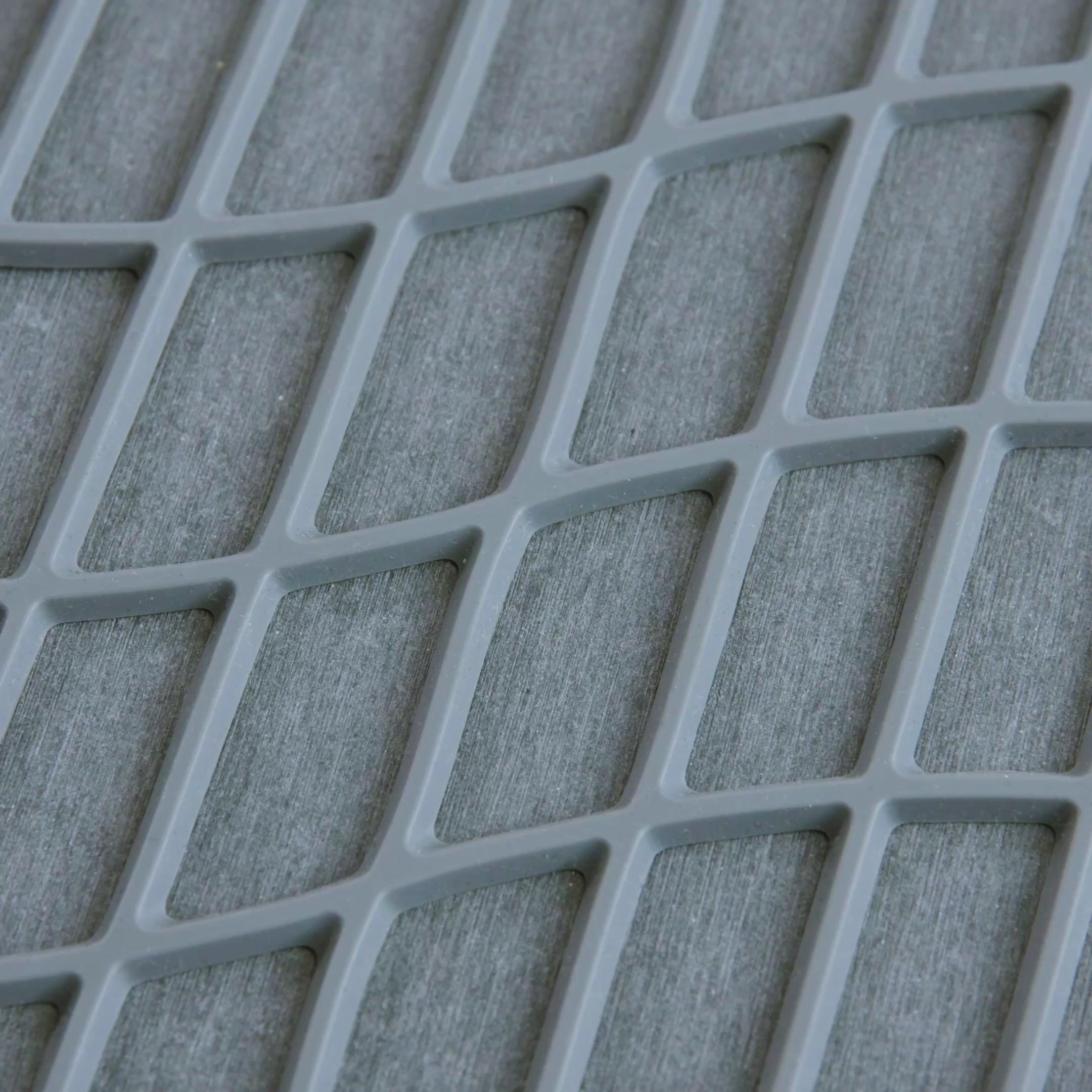 Water quickly drying on the Slate Original Drift Dish Pad. 