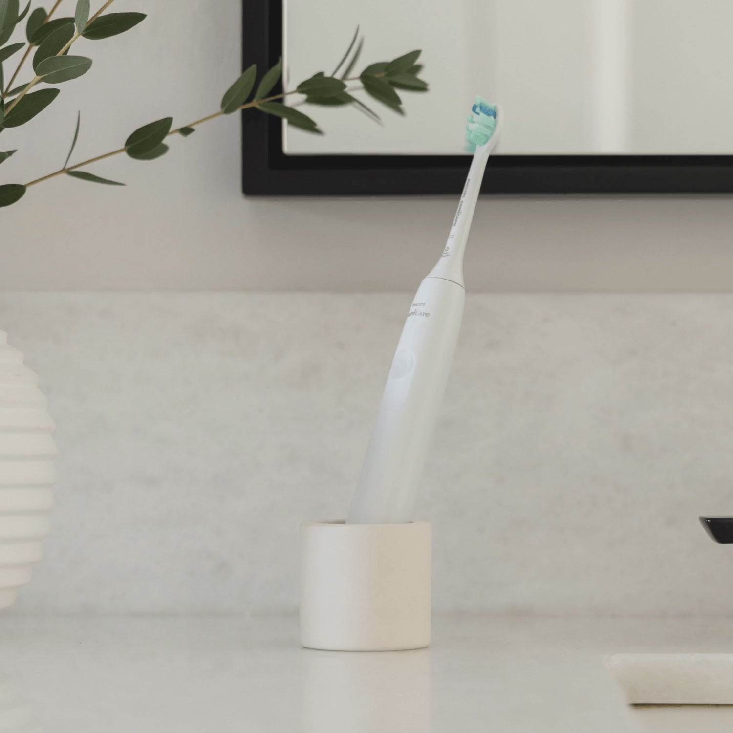 Looping video of a stone toothbrush holder, holding different items inside