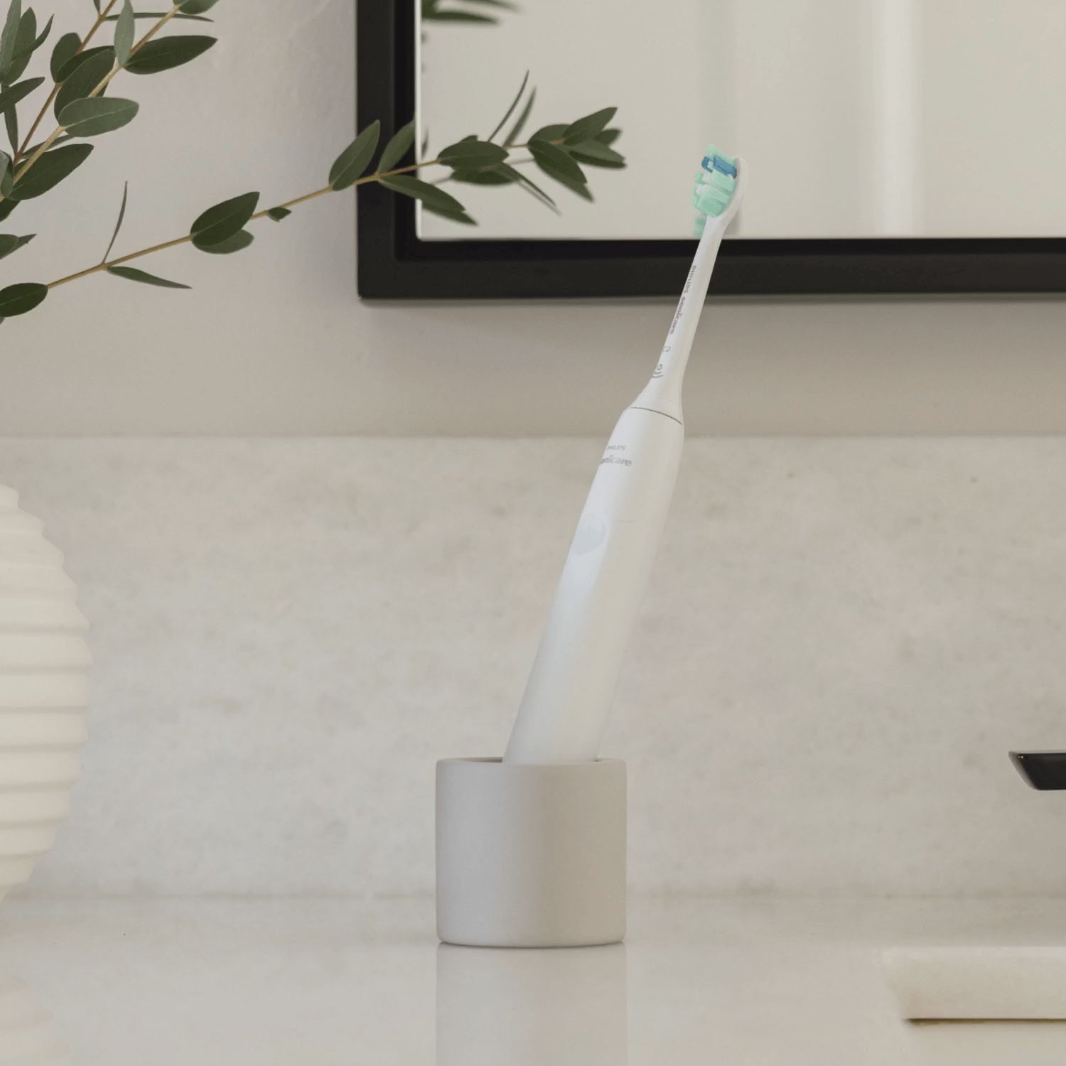 Looping video of a stone toothbrush holder, holding different items inside